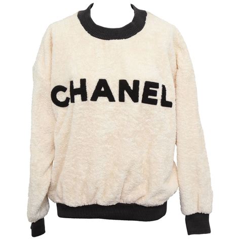 chanel jumper gold logo|chanel vintage sweater.